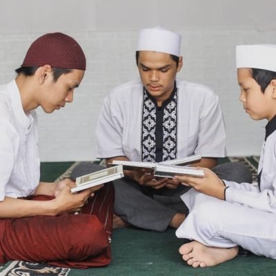 group-male-muslim-teenagers-who-fill-their-spare-time-by-taking-turns-reading-koran-mo Large